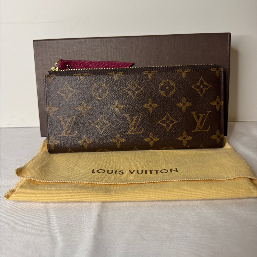 Louis Vuitton Adele Wallet
Double Zip And A Snap. (Burgundy )